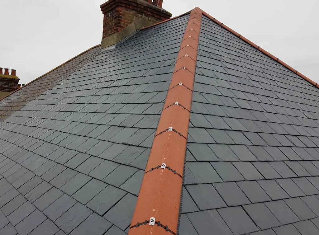 Slate roof with a terracotta dry ridge